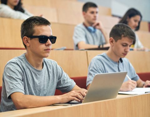 Blind student at lecture.